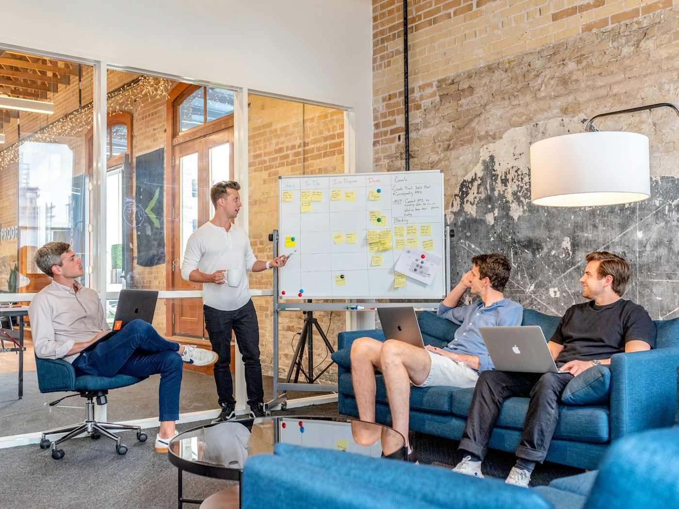 A team meeting round a whiteboard
