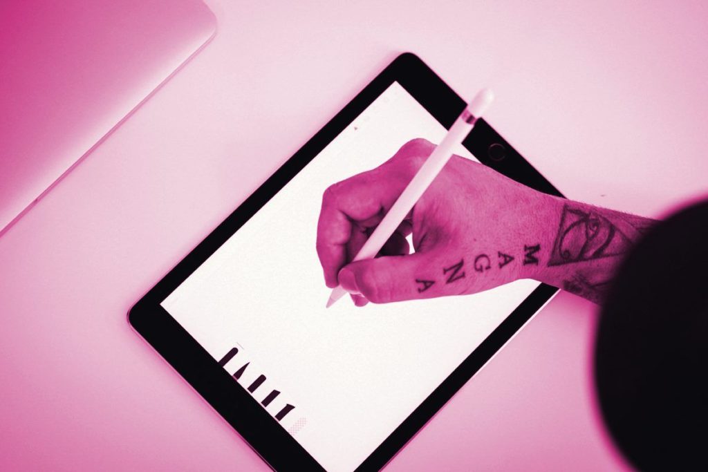 Someone drawing on a tablet