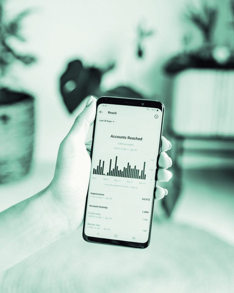 A phone showing a stats dashboard